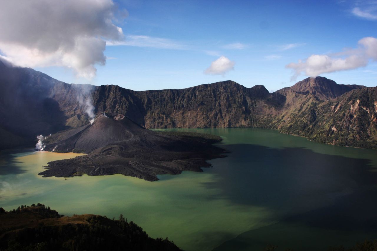Mount Rinjani, also known as Gunung Rinjani, is a 3,726-meter-high active volcano on the island of Lombok. The volcano's crater lake, known as Segara Anak, is a popular fishing spot for locals. 