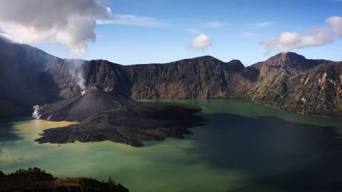 SENARU, LOMBOK, INDONESIA - MAY 19: A view of Mount Rinjani, also known as Gunung Rinjani, is seen on May 19, 2009 in Lombok, West Nusa Tenggara Province, Indonesia. The 3,726m active volcano is the third highest in Indonesia, and has been erupting this time around April 27, peaking on May 10. The volcano's crater lake, known as Segara Anak, is home to many goldfish and mujair fish and is a popular fishing spot for locals.  (Photo by Ulet Ifansasti/Getty Images)
