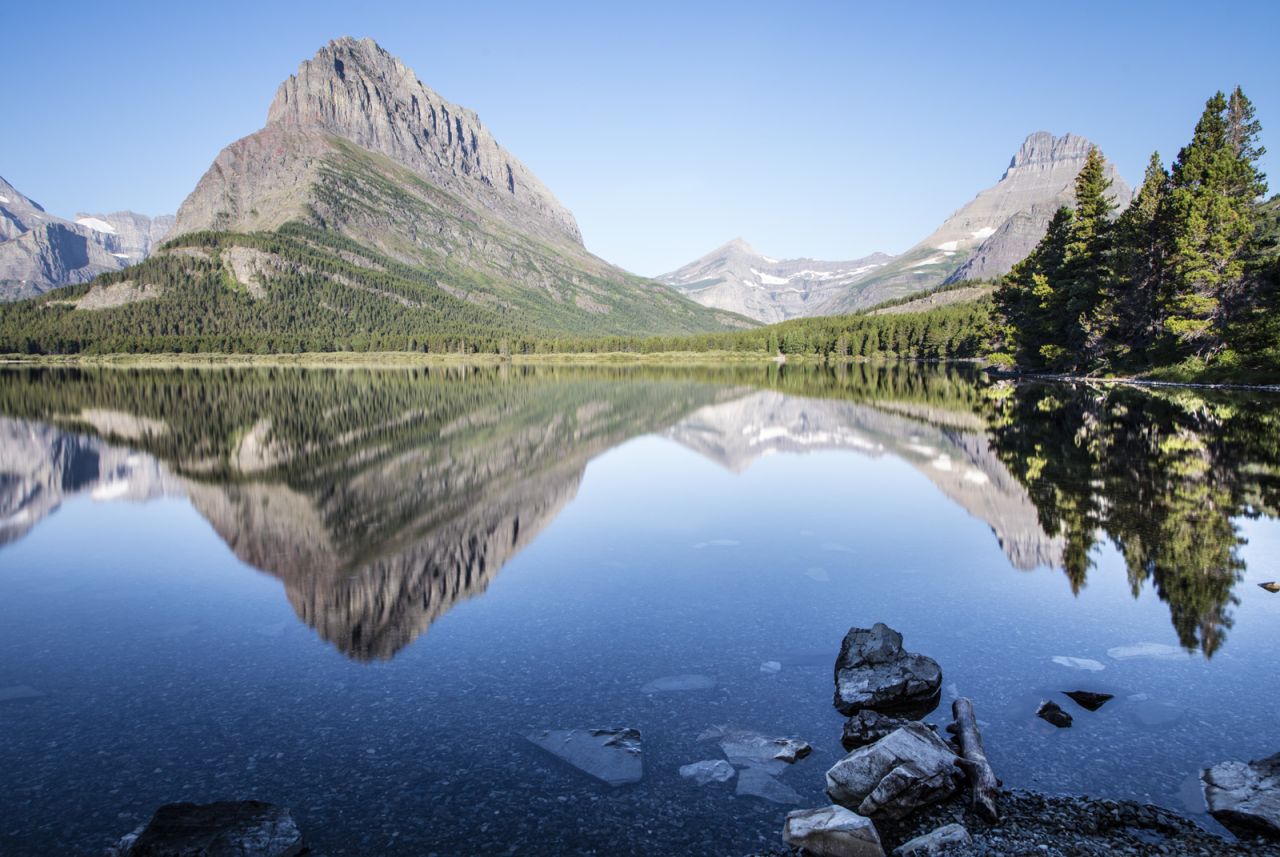The avid <a href="http://johnmcgrawphotography.com/" target="_blank" target="_blank">travel photographer</a> stopped for many photo opportunities throughout the park, like Swiftcurrent Lake (above), Highline Trail and Grinnell Glacier.