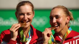 RIO DE JANEIRO, BRAZIL - AUGUST 14:  Gold medalists Elena Vesnina and Ekaterina Makarova of Russia pose on the podium during the ceremony for the women's doubles on Day 9 of the Rio 2016 Olympic Games at the Olympic Tennis Centre on August 14, 2016 in Rio de Janeiro, Brazil.  (Photo by Clive Brunskill/Getty Images)