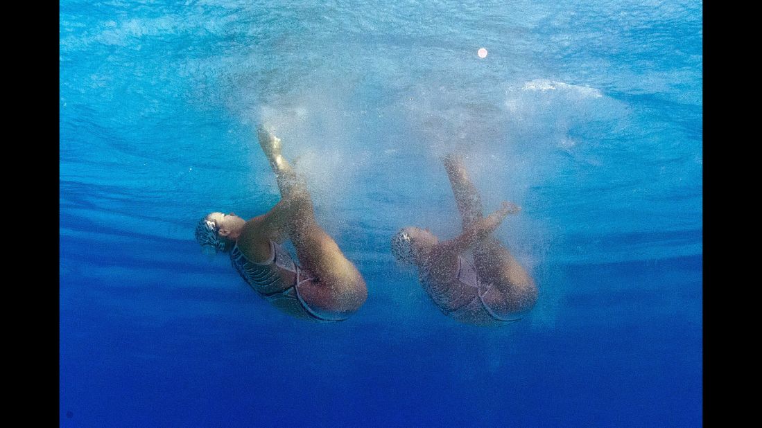 A picture taken underwater shows Chinese synchronized swimmers Huang Xuechen and Sun Wenyan competing in the duets preliminaries.