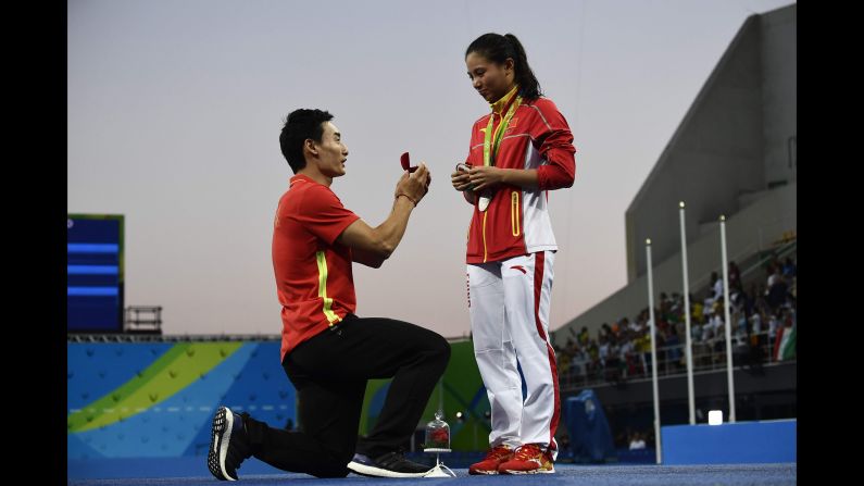 China's Qin Kai <a href="index.php?page=&url=http%3A%2F%2Fwww.cnn.com%2F2016%2F08%2F14%2Fsport%2Fchina-diving-marriage-proposal-rio-2016-olympics%2Findex.html" target="_blank">proposes to fellow diver He Zi</a> after she received silver in the 3-meter springboard on Sunday, August 14.
