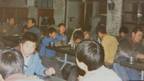 Inmates eating at Brothers Home,  a state welfare facility  created to clean up the streets and house "vagrants" ahead of the 1988 Summer Olympics in Seoul.