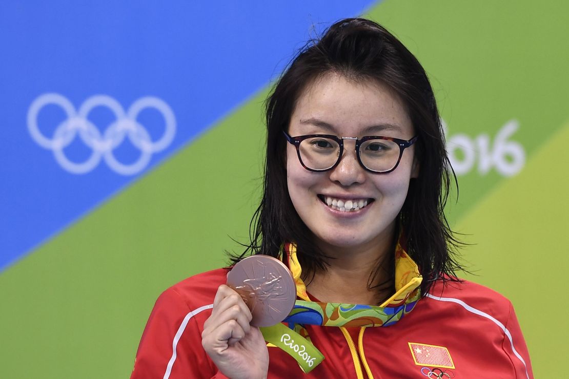 China's Fu Yuanhui poses with her bronze medal for the 100m backstroke on August 8.