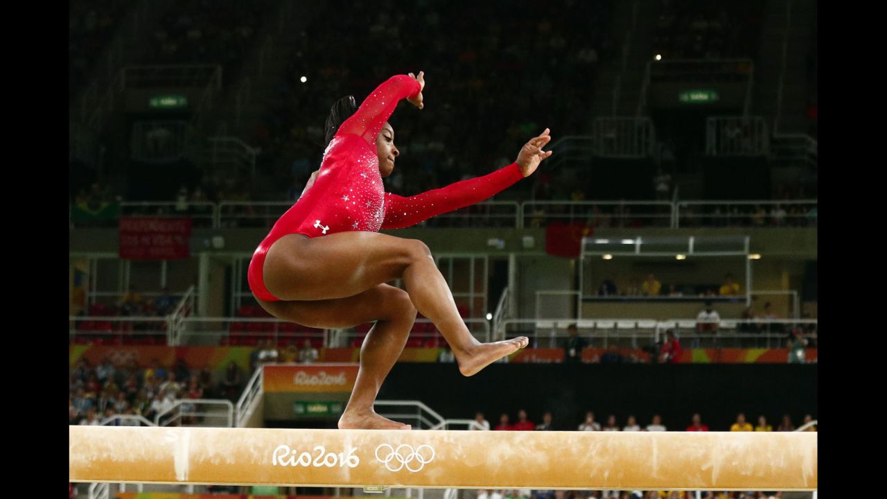 U.S. gymnast Simone Biles, who had already won the individual all-around and the vault, wobbles during the balance beam finals on Monday, August 15. She finished with the bronze.