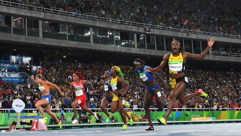 Jamaica's Elaine Thompson, right, wins the 100-meter final -- and the title of <a href="index.php?page=&url=http%3A%2F%2Fwww.cnn.com%2F2016%2F08%2F13%2Fsport%2Felaine-thompson-olympic-games-rio-2016%2F" target="_blank">world's fastest woman</a> -- on Saturday, August 13. 