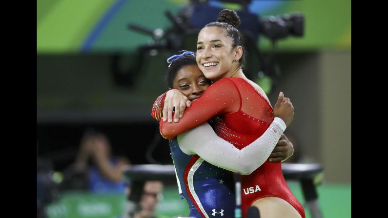 U.S. gymnasts Simone Biles, left, and Aly Raisman hug after winning gold and silver in <a href="index.php?page=&url=http%3A%2F%2Fwww.cnn.com%2F2016%2F08%2F11%2Fsport%2Fsimone-biles-usa-gymnastics-rio%2F" target="_blank">the individual all-around</a> on Thursday, August 11.