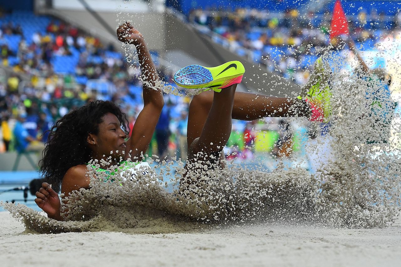 Brazilian athlete Nubia Soares lands in the sand pit while competing in the triple jump on Saturday, August 13.