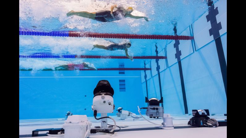 Cameras are set up at the bottom of the swimming pool as women take part in a 50-meter freestyle heat on Friday, August 12. <a href="index.php?page=&url=http%3A%2F%2Fwww.cnn.com%2F2016%2F08%2F11%2Fsport%2Fcnnphotos-al-bello-olympics%2F" target="_blank">Catching the Olympic moments that TV doesn't</a>