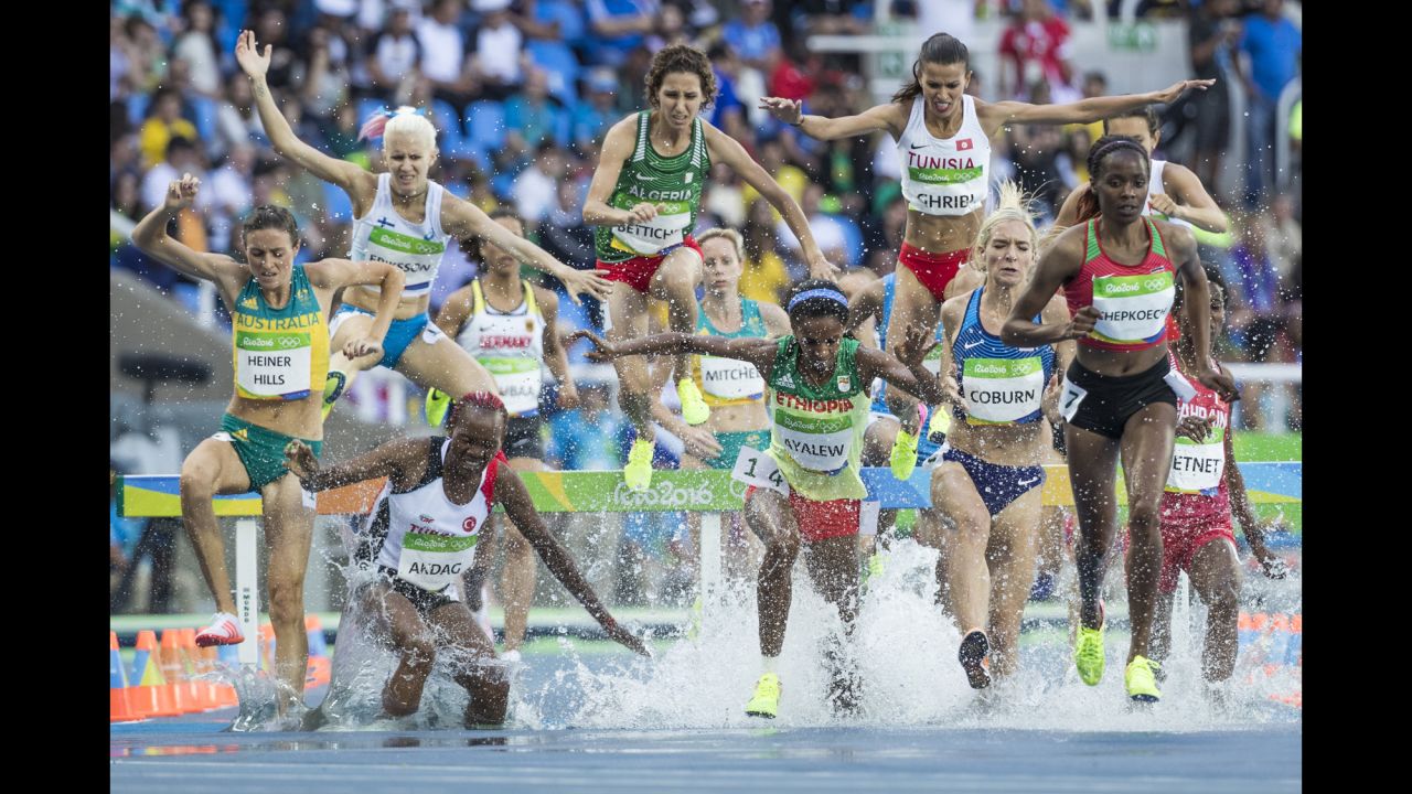 Athletes race in the semifinals of the 3,000-meter steeplechase on Sunday, August 14.