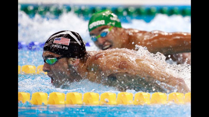 South Africa's Chad Le Clos, right, looks over at Michael Phelps during <a href="index.php?page=&url=http%3A%2F%2Fwww.cnn.com%2F2016%2F08%2F09%2Fsport%2Fmichael-phelps-katie-ledecky-swimming%2Findex.html" target="_blank">the 200-meter butterfly final</a> on Tuesday, August 9. Phelps' victory avenged one of the few losses of his Olympic career -- a second-place finish to Le Clos in 2012. 