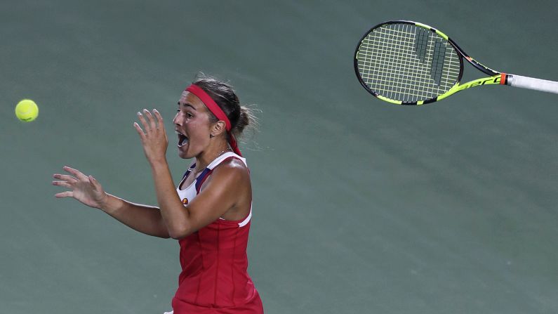 Monica Puig tosses her racket after winning Puerto Rico's first Olympic gold medal on Saturday, August 13. Puig <a href="index.php?page=&url=http%3A%2F%2Fwww.cnn.com%2F2016%2F08%2F13%2Ftennis%2Fmonica-puig-angelique-kerber-olympic-tennis%2Findex.html" target="_blank">defeated Germany's Angelique Kerber</a> in three sets, becoming the first unseeded player to win gold since women's tennis was reintroduced in 1988.