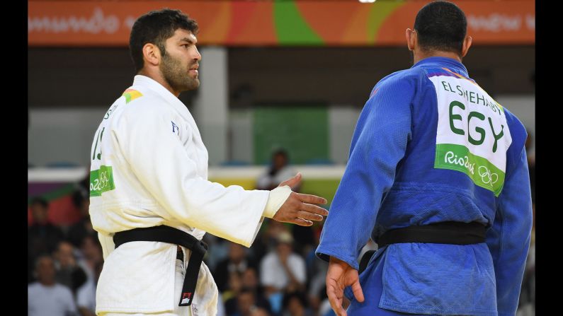 Israel's Or Sasson offers a handshake to Egypt's Islam El Shehaby after their judo match on Friday, August 12. El Shehaby refused and <a href="index.php?page=&url=http%3A%2F%2Fwww.bbc.com%2Fsport%2Folympics%2F37090339" target="_blank" target="_blank">was later sent home</a> by the Egyptian Olympic Committee.