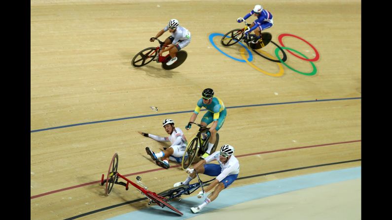 Viviani, front, gets caught up in a crash during the points race portion of the omnium event. British cyclist Mark Cavendish <a href="index.php?page=&url=http%3A%2F%2Fedition.cnn.com%2F2016%2F08%2F15%2Fsport%2Folympics-cycling-mark-cavendish-park-sanghoon%2Findex.html" target="_blank">apologized for causing the crash,</a> which led to South Korea's Park Sang-hoon being taken off on a stretcher.