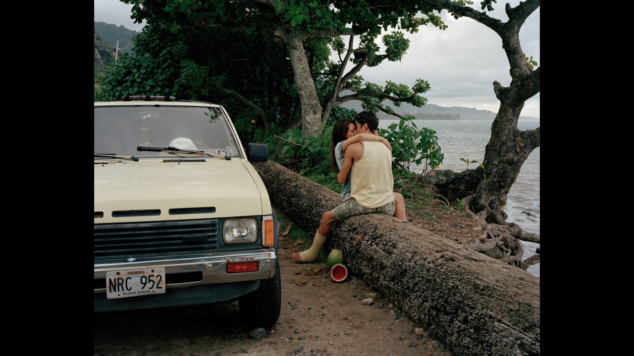 A couple kisses on the Hawaiian island of Oahu in 2014. Photographer Phil Jung wanted to get away from the cliche tourist spots and photograph what he saw as the real Hawaii.