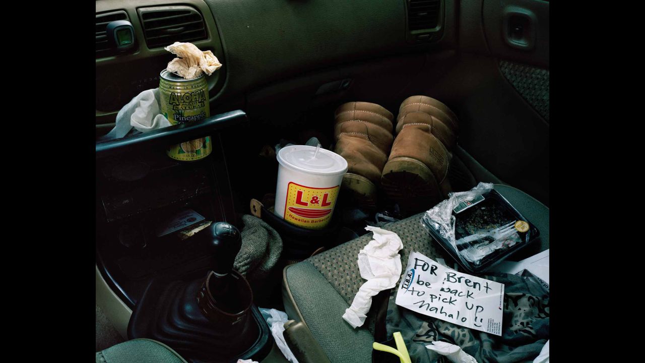 The inside of one Hawaiian's car. "I don't know this individual well, but it looks to me like he works pretty hard," Jung said. "He's got his boots in his car. You can tell he's got his L&L Hawaiian Barbecue (a famous local fast-food chain) and his can of Aloha Maid soda (a classic local beverage). He's got to eat in his car to get his lunch before he goes to his next job."