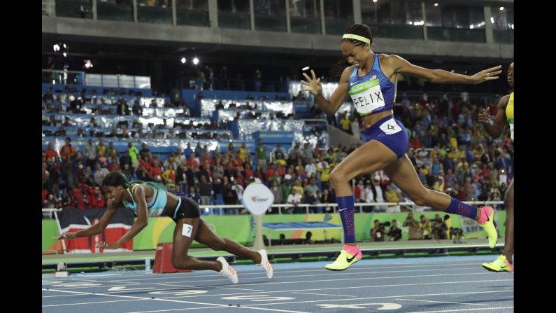 Shaunae Miller of the Bahamas <a href="index.php?page=&url=http%3A%2F%2Fedition.cnn.com%2F2016%2F08%2F15%2Fsport%2Fallyson-felix-athletics-olympics%2Findex.html" target="_blank">dives over the finish line</a> to win gold in the 400 meters on Monday, August 15. She edged American Allyson Felix by .07 seconds.