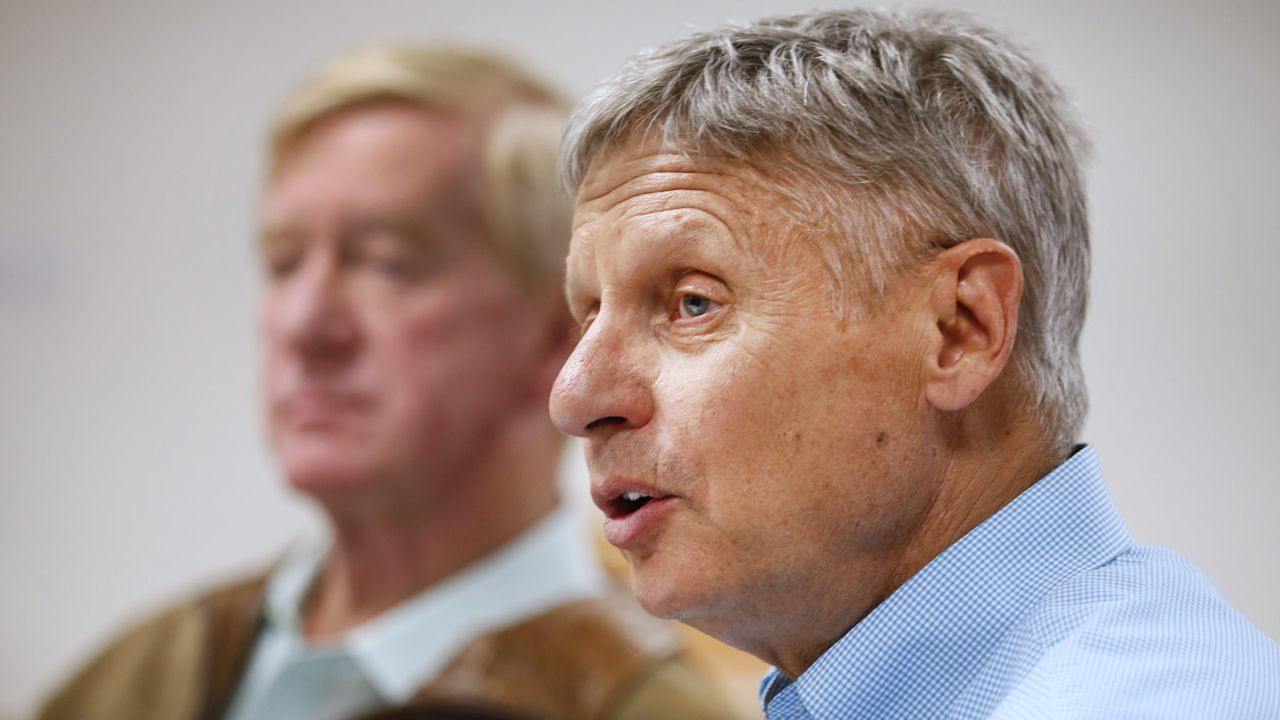 Libertarian presidential candidate Gary Johnson (R), and his running mate Bill Weld (L), talk to the press before a rally on August 6, 2015 in Salt Lake City, Utah. 