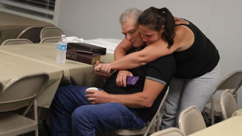 Robert Enfinger and his wife, Michelle, spend the night in a church that had been turned into an evacuation shelter in Walker.