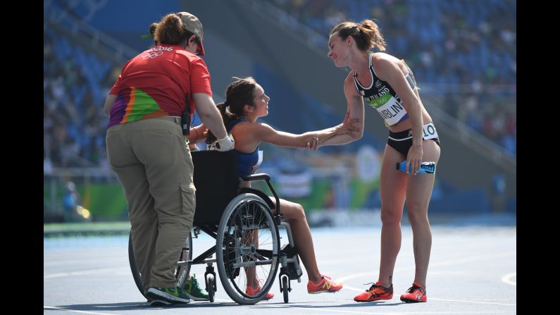 Abbey D'Agostino of the United States leaves the track on a wheelchair after twisting her ankle in the 5000-meter semifinal on Tuesday, August 16. D'Agostino and New Zealand's Nikki Hamblin, right, <a href="index.php?page=&url=http%3A%2F%2Fwww.nbcolympics.com%2Fvideo%2Fus-runner-finishes-race-after-falling-hard" target="_blank" target="_blank">collided during the race</a> but helped each other up and managed to make it to the finish line.