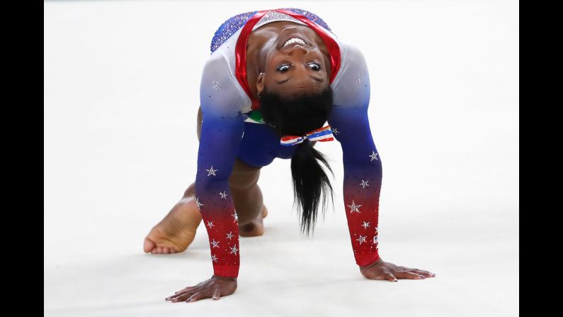 U.S. gymnast Simone Biles competes in the floor exercise. She <a href="index.php?page=&url=http%3A%2F%2Fedition.cnn.com%2F2016%2F08%2F16%2Fsport%2Fsimone-biles-gold-floor%2Findex.html" target="_blank">won the event,</a> finishing this year's Games with her fourth gold and fifth medal overall. Biles is the first woman to win four gymnastics golds in a single Olympics since Romania's Ecaterina Szabo in 1984. 