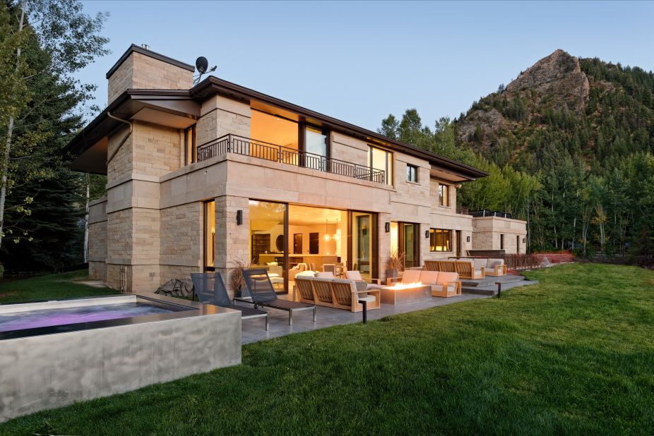 Luxury vacation rental Castle Rim in Aspen, Colorado, features six bedrooms and a private terrace with a huge hot tub, fire pit and al fresco dining.