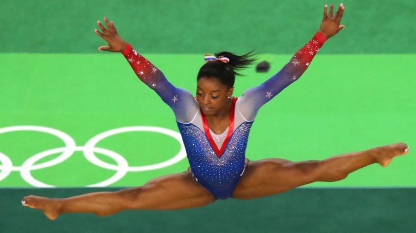 U.S. gymnast Simone Biles won a record-tying four gold medals and one bronze as she dazzled the crowd with a mix of elegance and athleticism rarely seen in the sport.