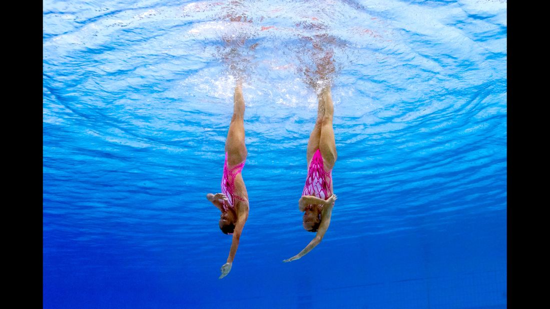 Italy's Costanza Ferro and Linda Cerruti perform their technical routine during synchronized swimming.