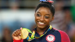 Gold medalist Simone Biles of the United States celebrates on the podium at the medal ceremony for the Women's Floor on Day 11 of the Rio 2016 Olympic Games, August 16, 2016 in Rio de Janeiro, Brazil.