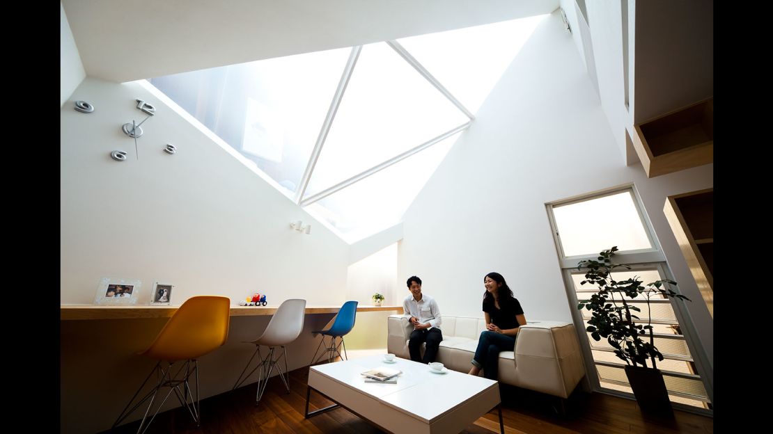 Aptly named "Framing the Sky," this Atelier Tekuto home was built on a polygon-shaped site. The architects focused on the relationship between nature and people, by incorporating a large skylight to make the home feel like it was extending upwards into the sky.