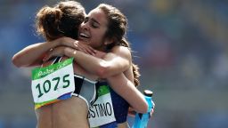 Abbey D'Agostino of the US (R) hugs New Zealand's Nikki Hamblin after the women's 5000m heats.