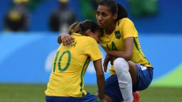 Brazil's player Bruna (R) comforts teammate Marta after losing to Sweden in their Rio 2016 Olympic Games Women's semi-final football match at the Maracana Stadium in Rio de Janeiro, Brazil, on August 16, 2016.                                   / AFP / VANDERLEI ALMEIDA        (Photo credit should read VANDERLEI ALMEIDA/AFP/Getty Images)