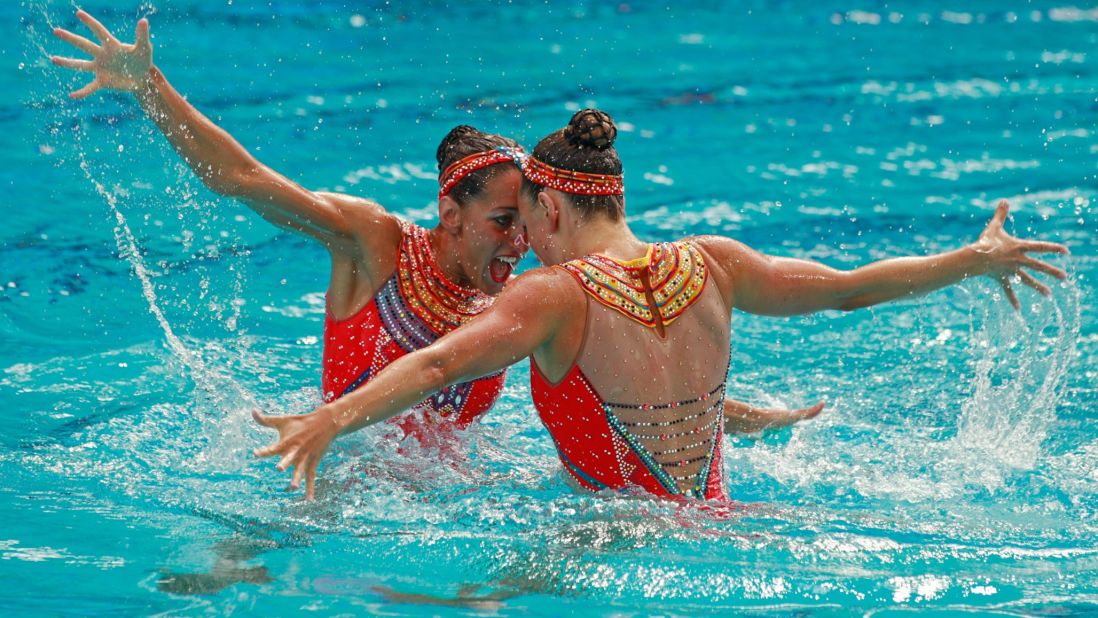French synchronized swimmers Laura Auge and Margaux Chretien compete in the duets final.