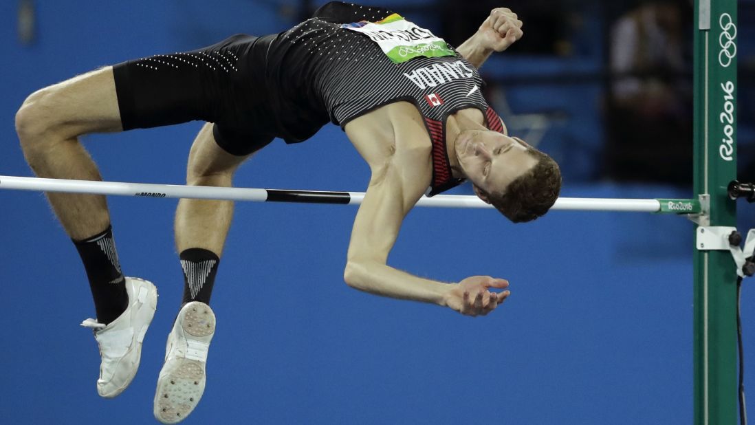 Canada's Derek Drouin clears the bar on his way to winning gold in the high jump on Tuesday, August 16.