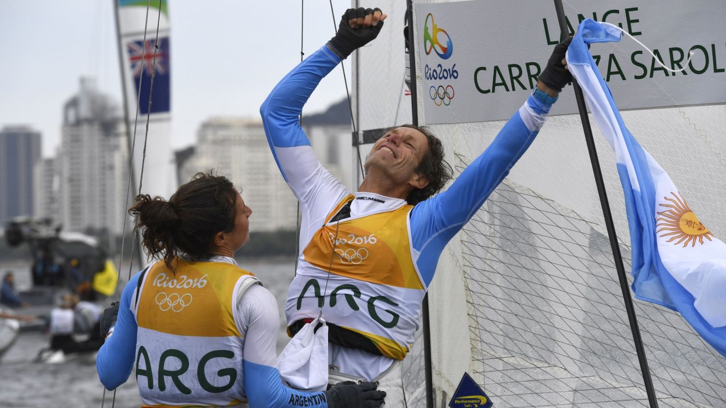 Argentina's Santiago Lange (right) and Cecilia Carranza Saroli celebrate winning sailing gold.