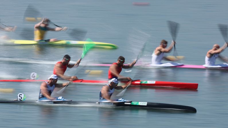 Canoe teams take part in a K-2 200-meter semifinal. 