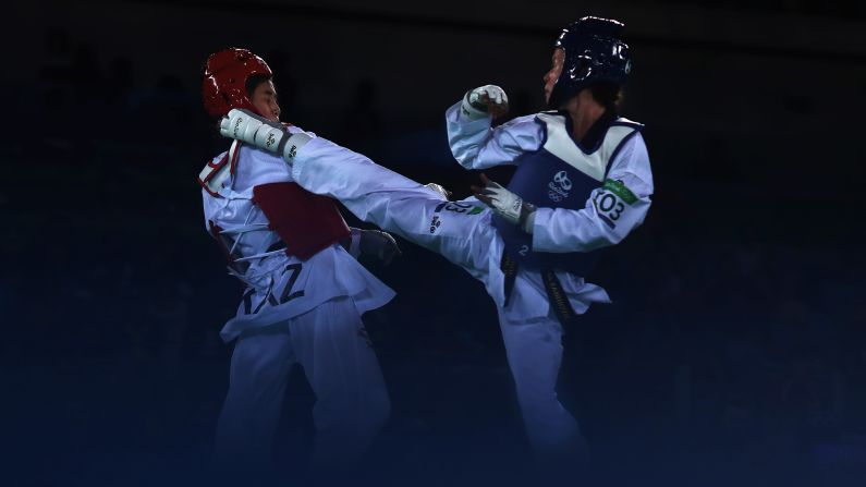 Ainur Yesbergenova of Kazakhstan, left, and Croatia's Lucija Zaninovic compete in a taekwondo bout.