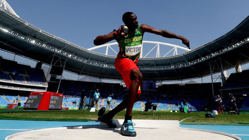 Lindon Victor of Grenada competes in the decathlon shot put.