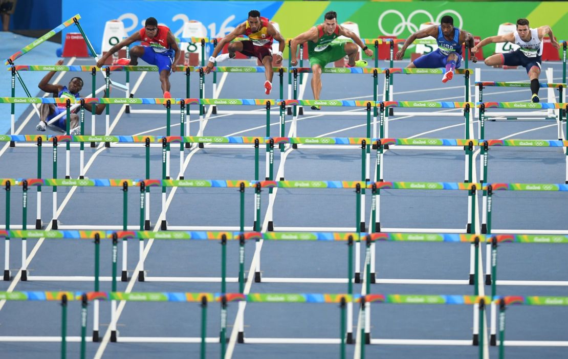Ouch! Haiti's Jeffrey Julmis, crashes into the first hurdle in the men's 110m hurdles semifinal.