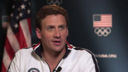 Ryan Lochte stands by his story that he and three swimmers were robbed.