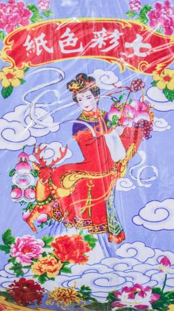 According to tradition, Guan Yin makes sure all spirits have something to eat and wear.