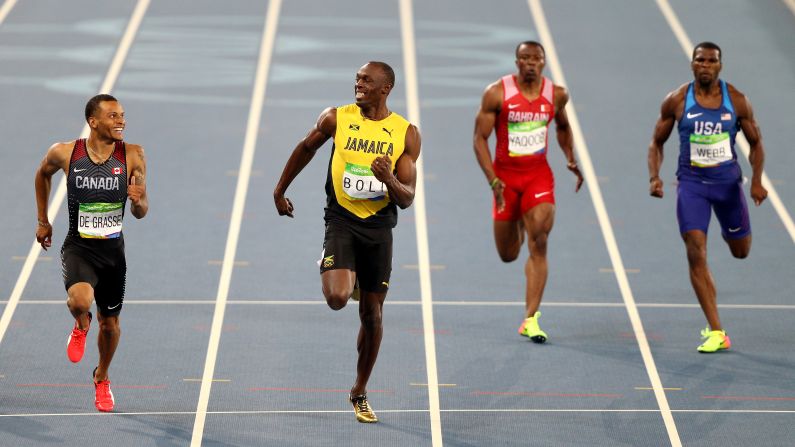 Canada's Andre De Grasse, left, and Jamaica's Usain Bolt smile at each other during a 200-meter semifinal on Wednesday, August 17. Bolt <a href="index.php?page=&url=http%3A%2F%2Fwww.cnn.com%2F2016%2F08%2F17%2Fsport%2Fusain-bolt-justin-gatlin-200m-rio%2Findex.html" target="_blank">finished first,</a> just in front of De Grasse.