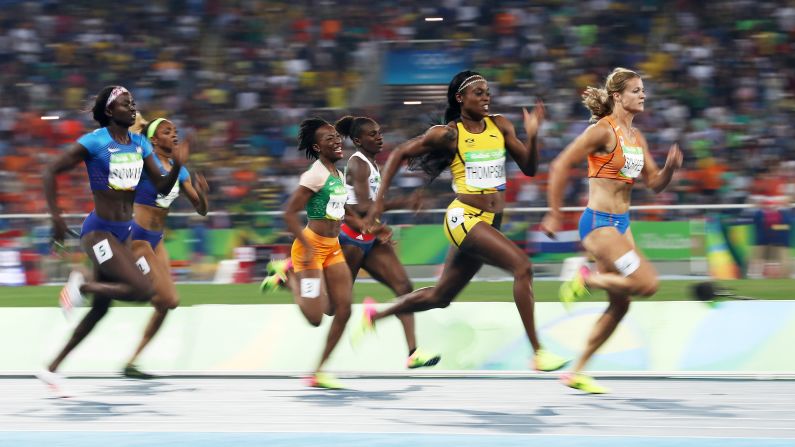 Jamaica's Elaine Thompson, second from right, edges the Netherlands' Dafne Schippers to win gold in the 200 meters. Thompson also won the 100-meter gold last week.
