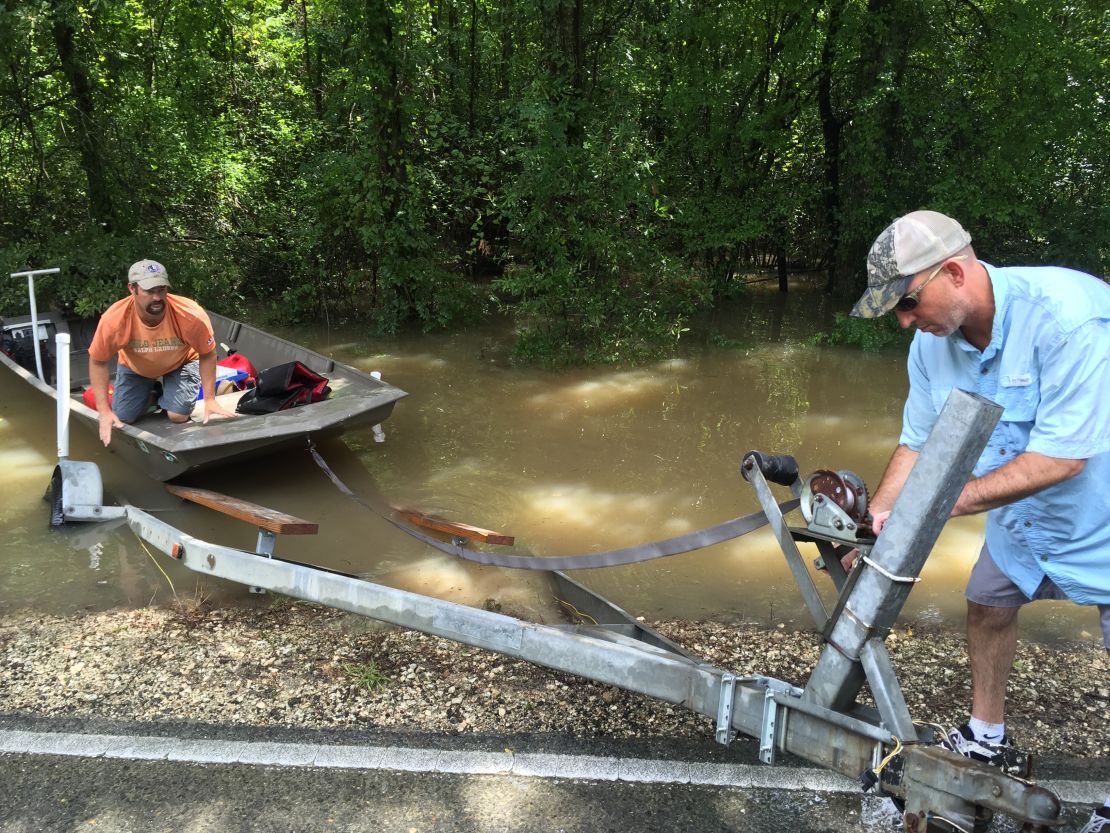 Matthew Robert, left, and Todd Daigle put their frog boat in the water.