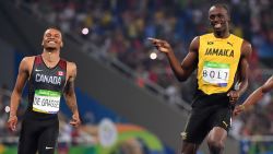 Jamaica's Usain Bolt (C) jokes with Canada's Andre De Grasse (L) after they crossed the finish line in the Men's 200m Semifinal during the athletics event at the Rio 2016 Olympic Games at the Olympic Stadium in Rio de Janeiro on August 17, 2016.   / AFP / OLIVIER MORIN        (Photo credit should read OLIVIER MORIN/AFP/Getty Images)