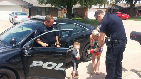 Brayden was amused by the police cruiser's lights and sounds.
