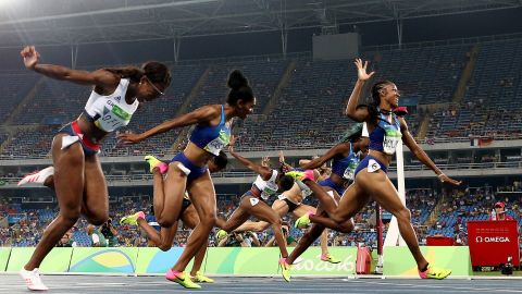 Brianna Rollins of the United States (R) wins the gold medal in the Women's 100m Hurdles Final in front of many empty seats.