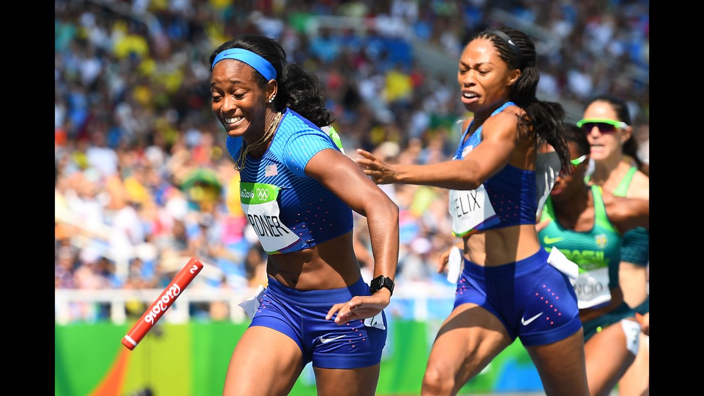 American Allyson Felix tries to hand the baton to teammate English Gardner in a 4x100-meter relay heat. The U.S. team was disqualified after dropping the baton, but it won an appeal after officials ruled the pair had been obstructed by a Brazilian runner during the exchange. They later clinched a spot in the final after a re-run.