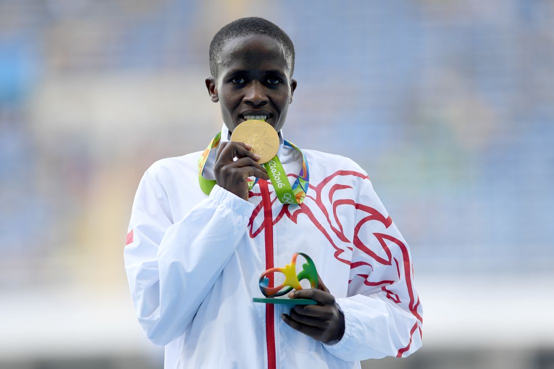 The taste of success ... Jebet enjoys that gold medal feeling.