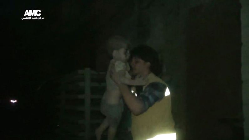 A civil defense worker carries Omran into the ambulance. The airstrike destroyed Omran's home, where he lived with his parents and two siblings. Director of the Aleppo Media Center Yousef Saddiq said Omran's 10-year-old brother, Ali, <a href="index.php?page=&url=http%3A%2F%2Fwww.cnn.com%2F2016%2F08%2F20%2Fmiddleeast%2Fsyria-conflict%2Findex.html" target="_blank">died from his injuries</a> on Saturday, August 20.